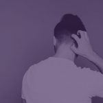 Back of mans head, white t-shirt, man itching his neck/head, purple hue over the entire image