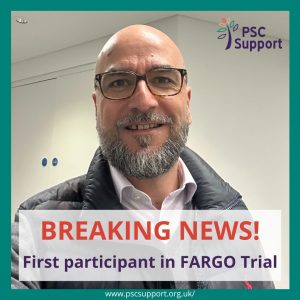 Photo of man smiling with glasses looking face on, words Breaking News, First participant in FARGO Trial at bottom of graphic