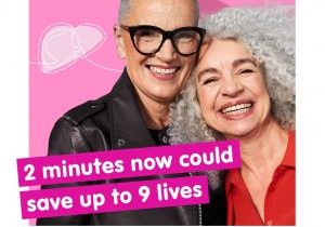 Two women smiling looking at camera, grey hair, pink background with text saying 2 minutes now could save up to 9 lives